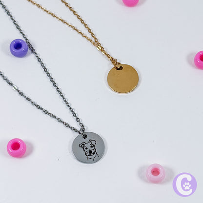 Two necklaces with round pendants on a white background with colorful beads.
