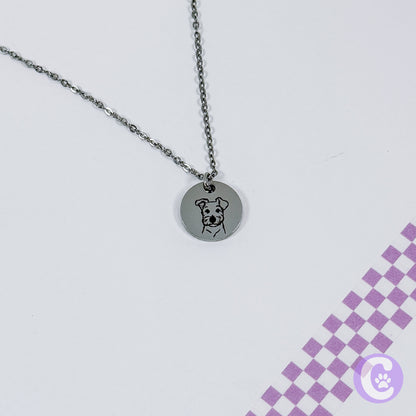Necklace with a round pendant featuring a dog illustration on a light gray background.