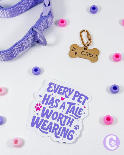 Pet collar with tag, sticker, and colorful beads on a light background