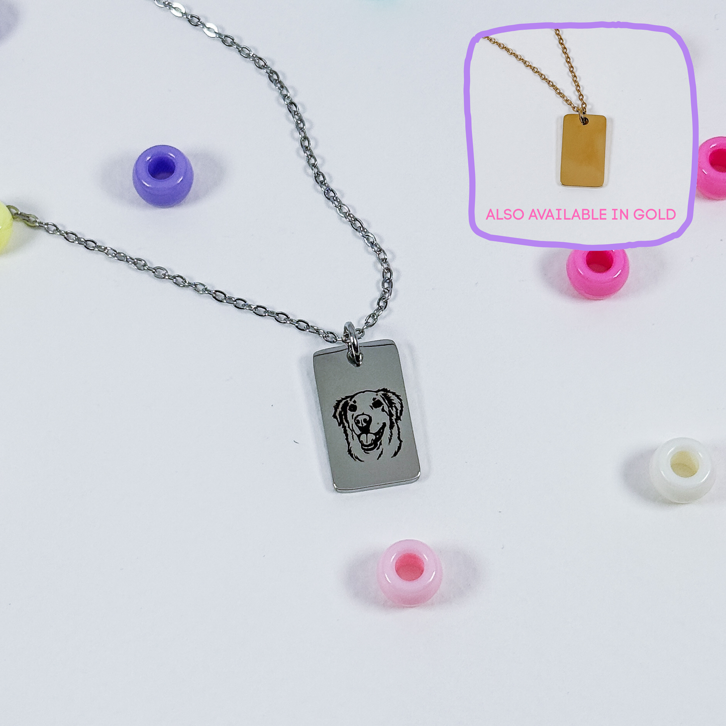 A silver rectangular pendant necklace with a dog face engraving, displayed on a white background with colorful beads. An inset in the top right shows the pendant on a gold chain with the text 'ALSO AVAILABLE IN GOLD'.